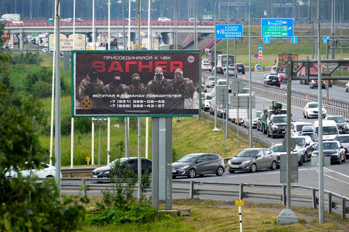 A billboard reading "Join us at Wagner", which is associated with the Wagner private military group and contractor Yevgeny Prigozhin, is seen above a highway on the outskirts of St. Petersburg, Russia, Saturday, June 24, 2023. Russia's security services have responded to mercenary chief Prigozhin's declaration of an armed rebellion by calling for his arrest. In a sign of how seriously the Kremlin took the threat, security was heightened in Moscow, Rostov-on-Don and other regions. (AP Photo)