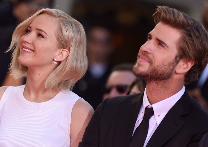 The World Of The Hunger Games  Jennifer Lawrence, Liam Hemsworth