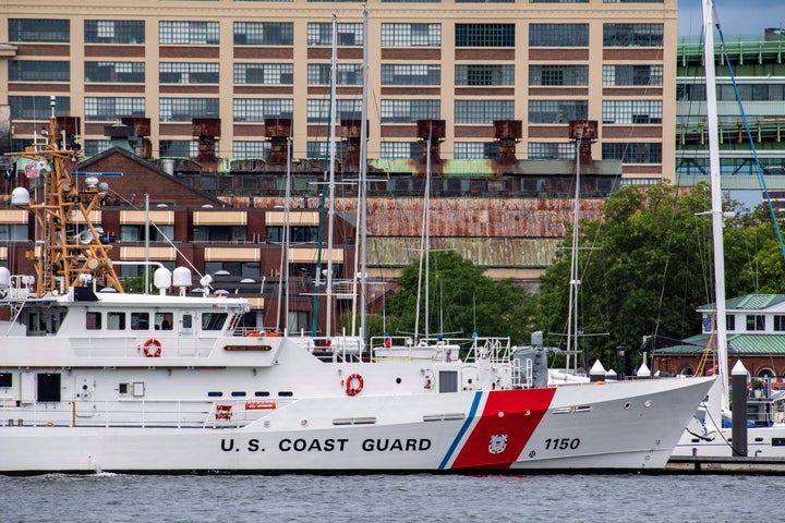 A U.S. Coast Guard vessel sits in a port near a Coast Guard Station amid the intense, days-long search for the missing submersible.