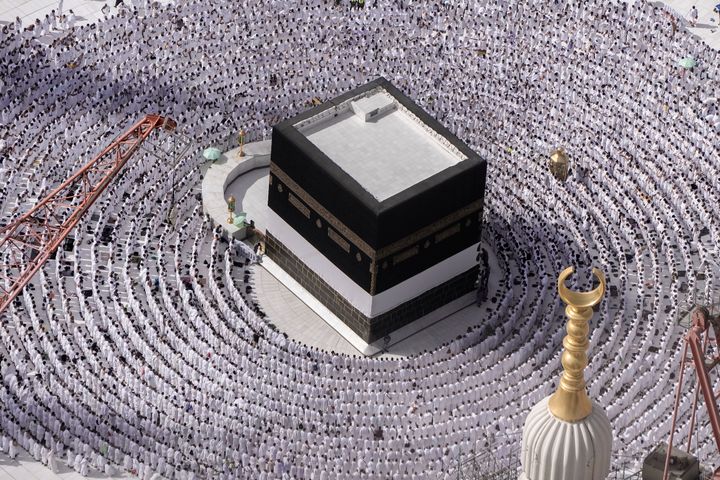 Muslim pilgrims pray around the Kaaba, the cubic building at the Grand Mosque, during the annual Hajj pilgrimage in Mecca, Saudi Arabia, Sunday, June 25, 2023. Muslim pilgrims are converging on Saudi Arabia's holy city of Mecca for the largest Hajj since the coronavirus pandemic severely curtailed access to one of Islam's five pillars. (AP Photo/Amr Nabil)