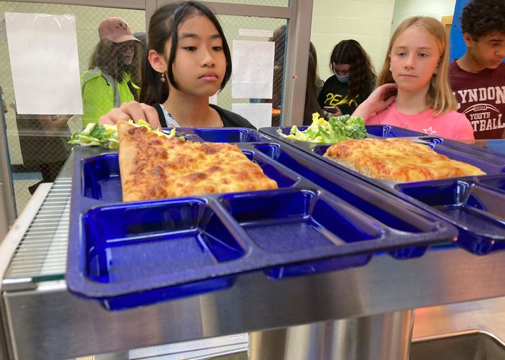 Students pick up lunch at the Albert D. Lawton Intermediate School in Essex Junction, Vermont, on June 9, 2022.