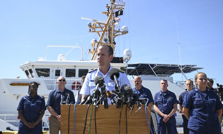U.S. Rear Adm. John Mauger, the First Coast Guard District commander, makes statements to the press at the U.S. Coast Guard Base Boston on June 22. Debris discovered on the ocean floor suggests the missing submersible near the wreck of the Titanic suffered a "catastrophic loss" of pressure, Mauger said.