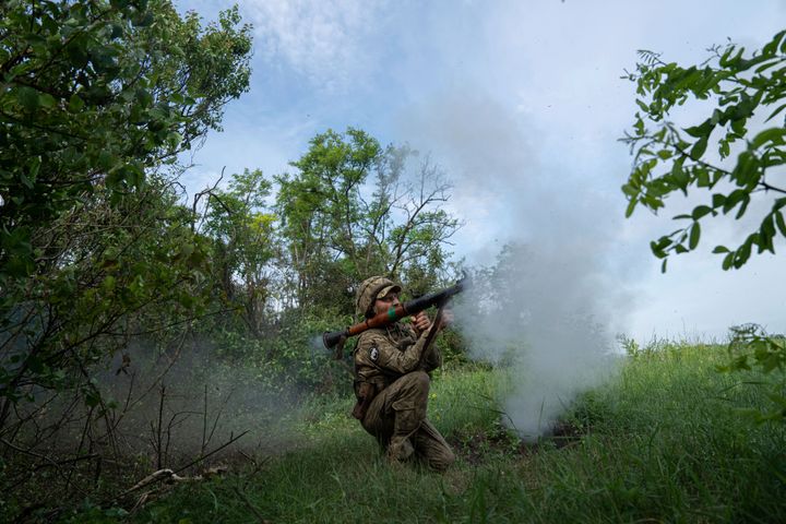 A Ukrainian serviceman of 28th brigade fires a RPG-9 towards Russian positions at the frontline in Donetsk.