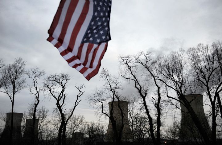 A U.S. flag flies in 2011 near the cooling towers of the Three Mile Island nuclear power plant, where the U.S. suffered its most serious nuclear accident in 1979, in Middletown, Pennsylvania.