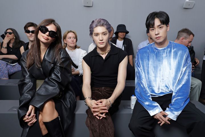 Emily Ratajkowski, Taeyong and Hu Yitian at the fashion show. 
