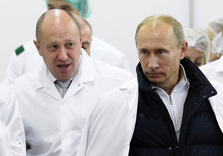 Businessman Yevgeny Prigozhin, left, pictured with Putin back in 2010.