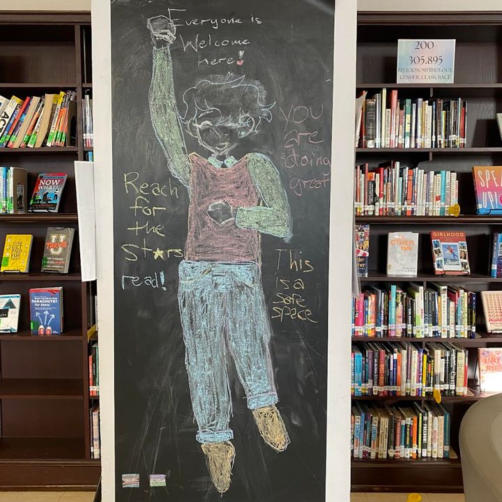 "This is student chalk art in our school library in October 2022, with quotes the student wrote, including, 'you are doing great' and 'this is a safe space,'" the author writes.