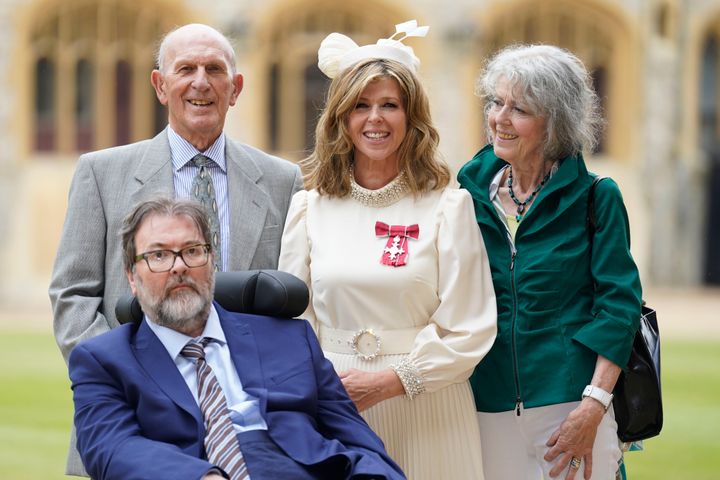 Kate Garraway, with her husband Derek Draper and her parents Gordon and Marilyn Garraway, after being made a MBE by the Prince of Wales during an investiture ceremony at Windsor Castle