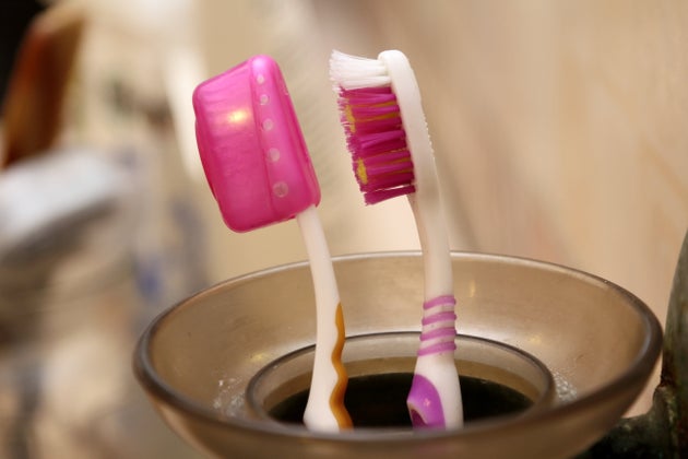 Despite appearances, toothbrush covers and cleanliness do not always mix.