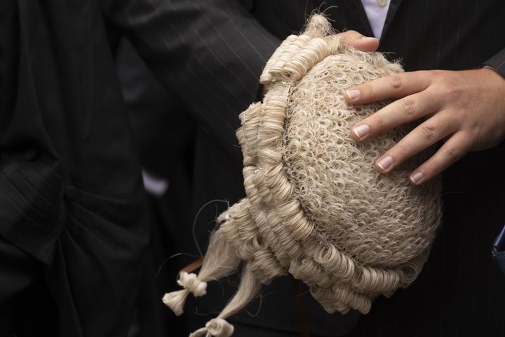 A lawyer holds a barrister's wig. Photographer: Jason Alden/Bloomberg
