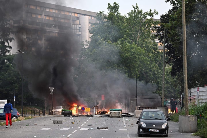 Smoke rises from a bonfire in a residential area during clashes in Toulouse, southwestern France on June 28, 2023.