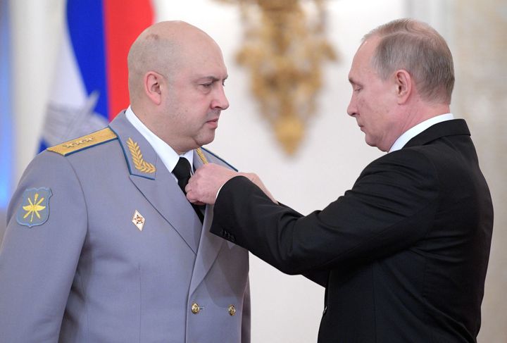 In this picture taken on December 28, 2017 Russian President Vladimir Putin presents an award to Colonel General Sergei Surovikin, the commander of Russian troops in Syria, during a ceremony to bestow state awards on military personnel who fought in Syria, at the Kremlin in Moscow. (Photo by Alexey DRUZHININ / SPUTNIK / AFP) (Photo by ALEXEY DRUZHININ/SPUTNIK/AFP via Getty Images)