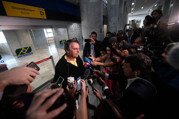 Former Brazilian President Jair Bolsonaro speaks to members of the media upon arrival at the Santos Dumont Airport in Rio de Janeiro, Brazil, on June 29, 2023.