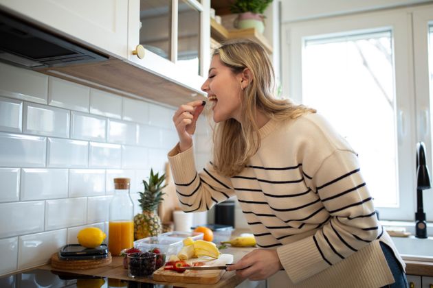 Woman preparing healthy fruit salad