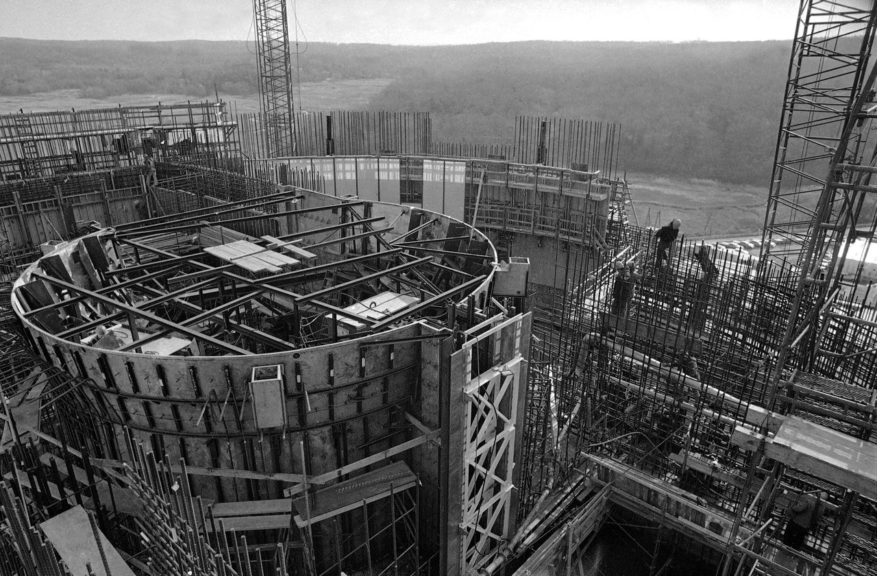 The cylindrical reactor core for the Shoreham Nuclear Plant in Brookhaven, New York, sits in the foreground as construction work continues on it, Jan. 17, 1977.