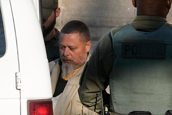 Officers escort Richard Matthew Allen out of the Carroll County courthouse following a Nov. 22, 2022, hearing in Delphi, Indiana.