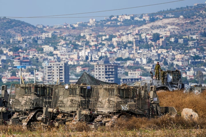 Israeli soldiers are seen in a staging area just outside the West Bank city of Jenin as seen from Israel, during an Israeli military raid on the militant stronghold of the Jenin refugee camp in the occupied West Bank, on July 4, 2023.