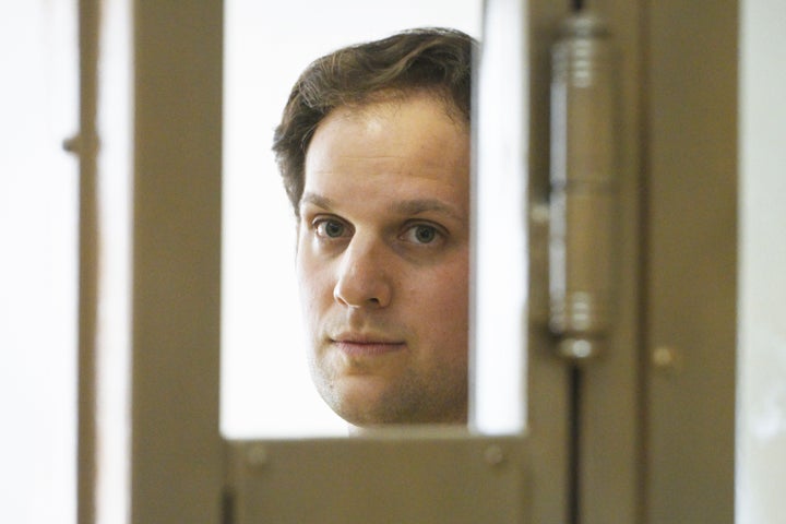 Wall Street Journal reporter Evan Gershkovich stands in a glass cage in a courtroom at the Moscow City Court in Moscow, Russia, on June 22, 2023.
