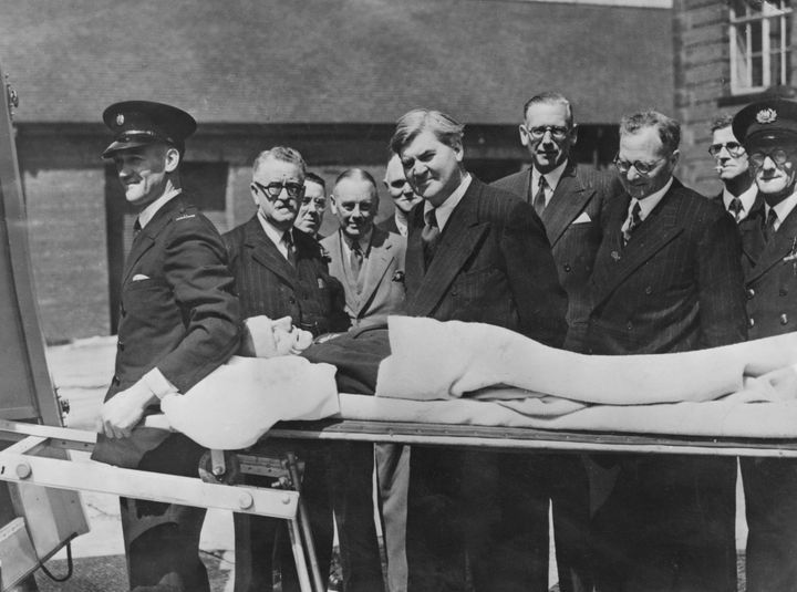 Welsh politician Aneurin Bevan, then-the Minister of Health, watches a demonstration of a new stretcher in Preston, on the first day of the new National Health Service, 5th July 1948.