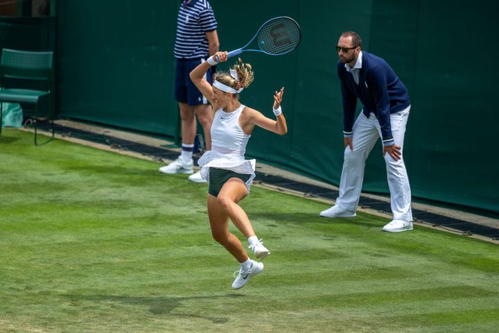Victoria Azarenka wearing green shorts in the Ladies' Singles first round match in Wimbledon