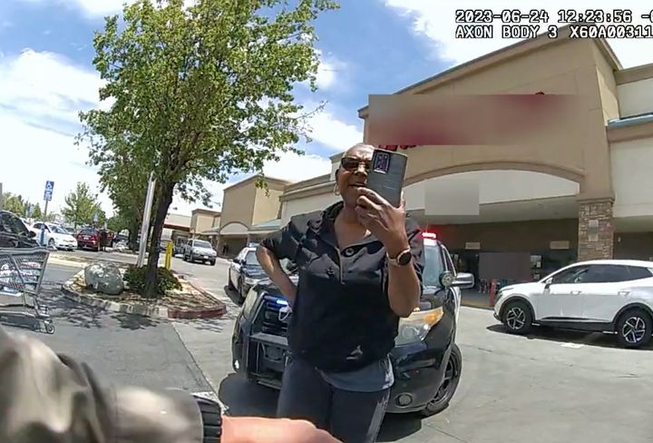 The woman was seen filming the deputies when forced to the ground and placed in handcuffs.