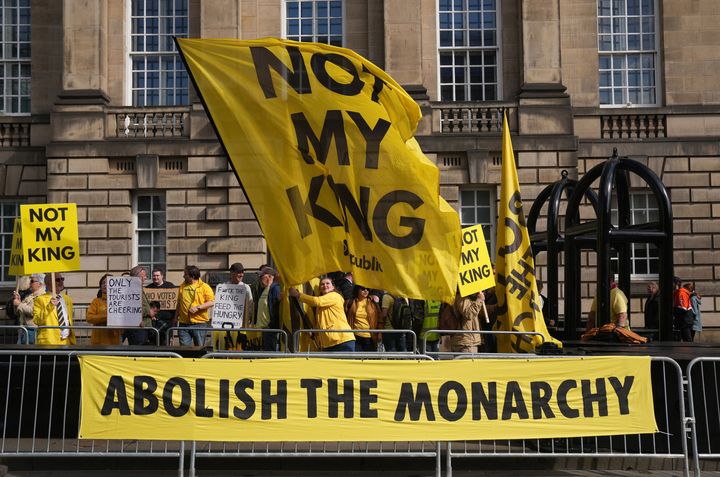 Anti-monarchy protesters gather near St Giles' Cathedral ahead of Scotland marking the coronation of King Charles III and Queen Camilla.