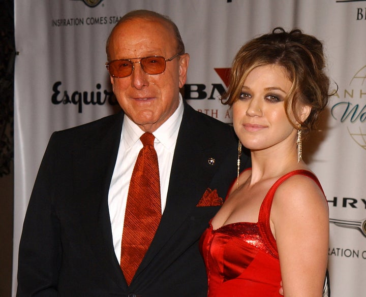 Clive davis and kelly clarkson on nov. 14, 2004, in beverly hills, california.