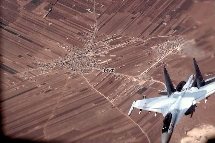 A Russian SU-35 flies near a U.S. Air Force MQ-9 Reaper drone over Syria.