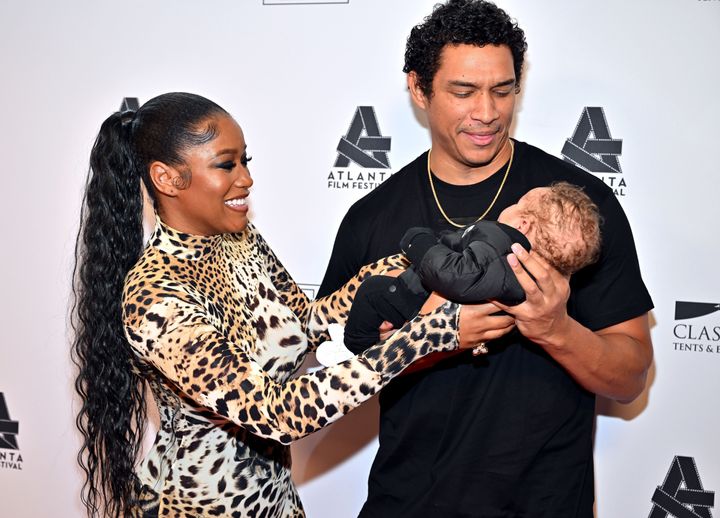 Keke Palmer (left) and Darius Jackson are pictured with their son in April.