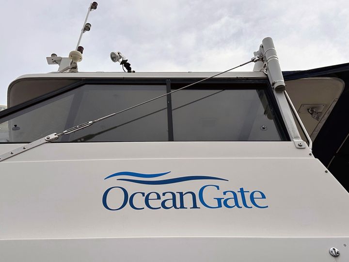 The logo for OceanGate Expeditions is seen on a boat parked near the offices of the company at a marine industrial warehouse in Everett, Wash.