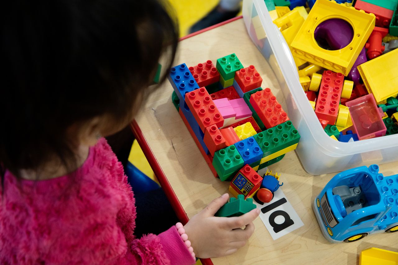 A child plays with building blocks at the Âu Cơ Preschool. 