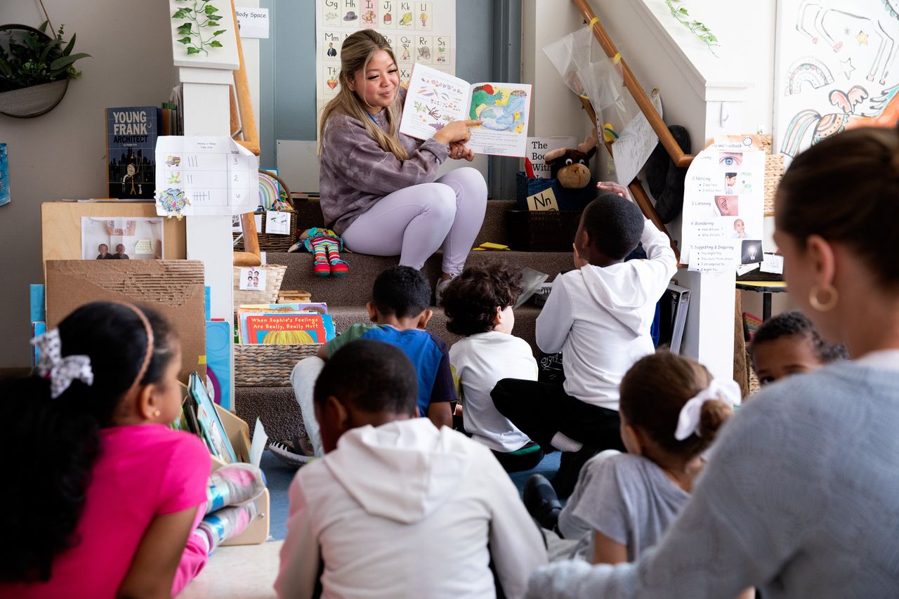 Teacher Elizabeth Nguyen reads a book to students in the pre-K program at the Boys & Girls Clubs of Dorchester.