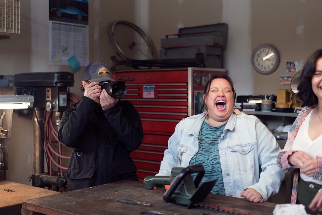 Brown taking photos during a brief scene break, while actor Jana Schmieding laughs at someone’s joke. "They don't need a lot of direction to make a great photo," Brown says of the cast members. "They just know how to do it by being themselves."