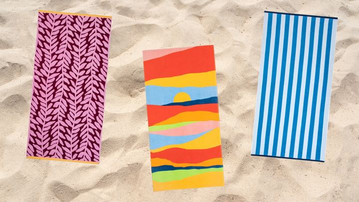 Towels designed with reef, sunset and stripe patterns