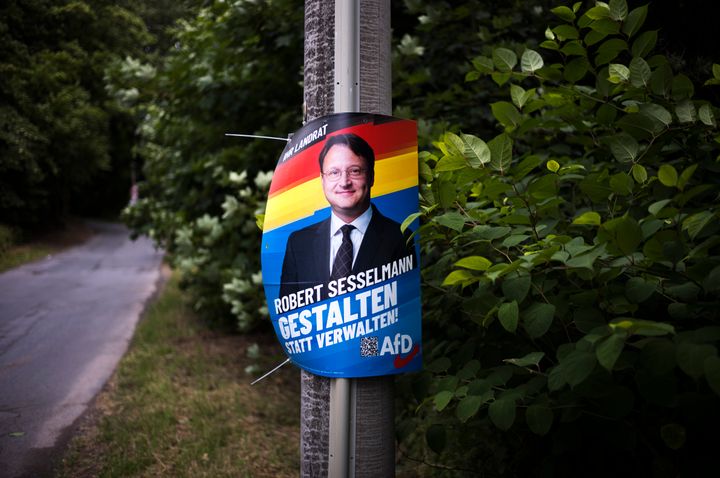 A election campaign poster for far-right AfD candidate Robert Sesselmann is seen at a street at the outskirts of the small city of Sonneberg in the German federal state of Thuringia.
