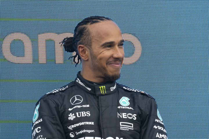 Third place winner Lewis Hamilton of Mercedes is seen on podium after the Formula 1 British Grand Prix at Silverstone Circuit on July 9.