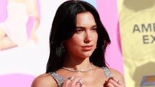 Dua Lipa Wears Just A Sparkly Thong Under Sheer Chain Mail Dress At ‘Barbie’ Premiere