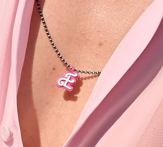 A closer look at the "E" necklace Gosling wore.
