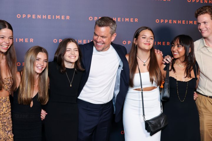 Two unidentified guests, Stella Damon, Matt Damon, Gia Damon, Alexia Barroso and another guest at the "Oppenheimer" premiere.