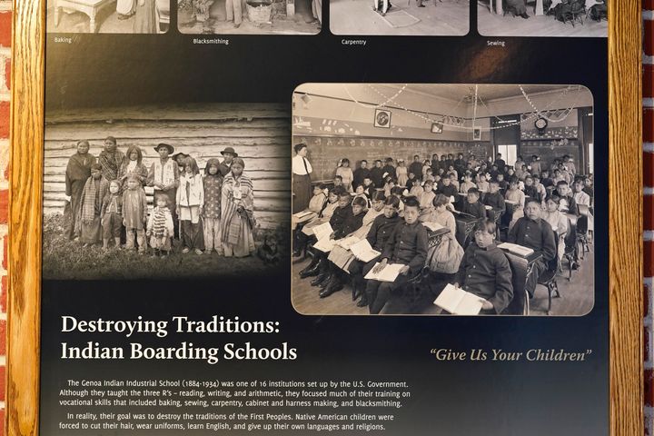 Photos of students in a classroom are seen on display in a museum at the former Genoa Indian Industrial School, Thursday, Oct. 27, 2022, in Genoa, Neb. 