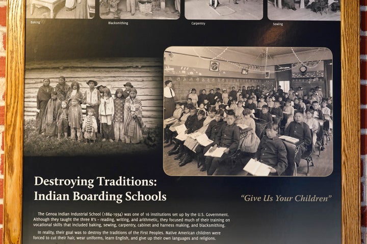 Photos of students in a classroom are seen on display in a museum at the former Genoa Indian Industrial School, Thursday, Oct. 27, 2022, in Genoa, Neb.