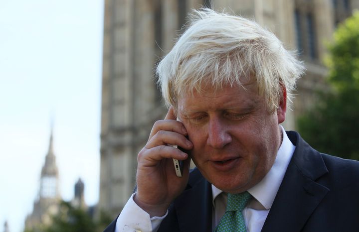Boris Johnson speaks on a phone in 2015.