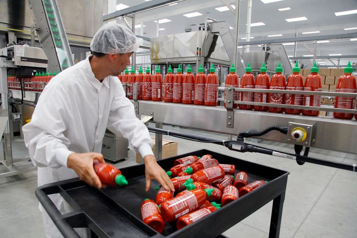 FILE - Sriracha chili sauce is produced at the Huy Fong Foods factory in Irwindale, California. The erosion of Huy Fong’s available supplies has rocked the prices of the brand’s Sriracha that is still available.