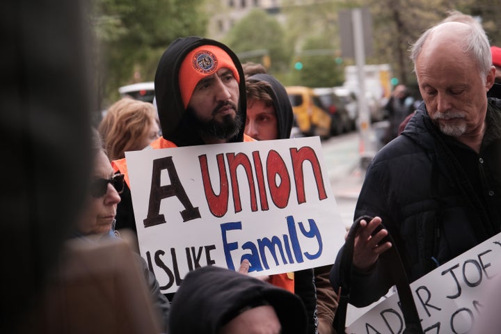 Trader Joe’s employees and union activists hold a rally at a Trader Joe’s in lower Manhattan last year. The company has just sued its workers' union alleging trademark infringement. 