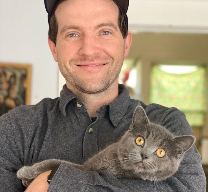 Colin Michael Smith is pictured with his cat, Smokey.