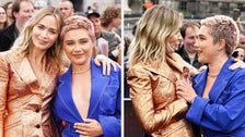 Florence Pugh Reacts Perfectly To Emily Blunt’s Suit Popping Open At “Oppenheimer” Event