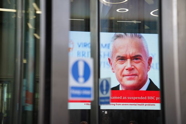 A screen in BBC Broadcasting house, in central London, displaying presenter Huw Edwards who was named by his wife Vicky Flind as the suspended BBC presenter.