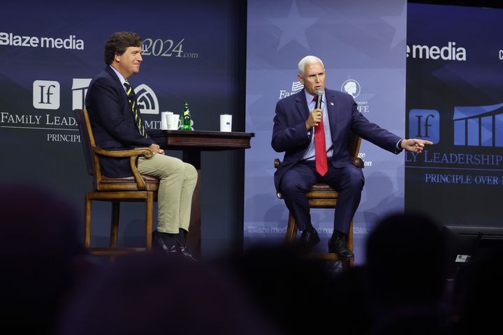 Former Vice President Mike Pence fields questions from former Fox News personality Tucker Carlson on July 14, 2023, in Des Moines, Iowa. Several Republican presidential candidates were scheduled to speak at the event, billed as “The Midwest’s largest gathering of Christians seeking cultural transformation in the family, Church, government, and more.”