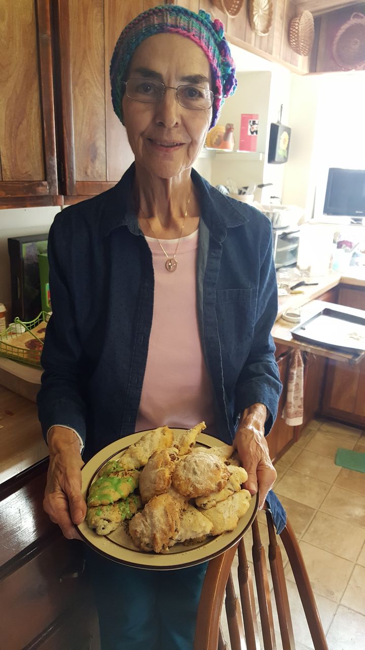 The author's mom showing off her last Christmas cookies.