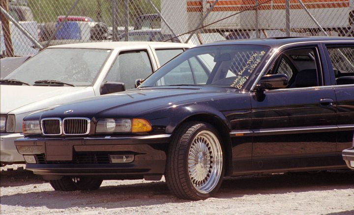 A black BMW with bullet holes is seen in a Las Vegas police impound lot on Sept. 8, 1996. Rapper Tupac Shakur was shot while riding in the car driven by Death Row Records chairman Suge Knight a day earlier.